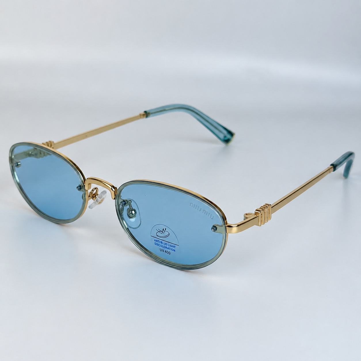 MIU MIU — Monture Ovale Sans Cerclage, Verres Bleu Clair