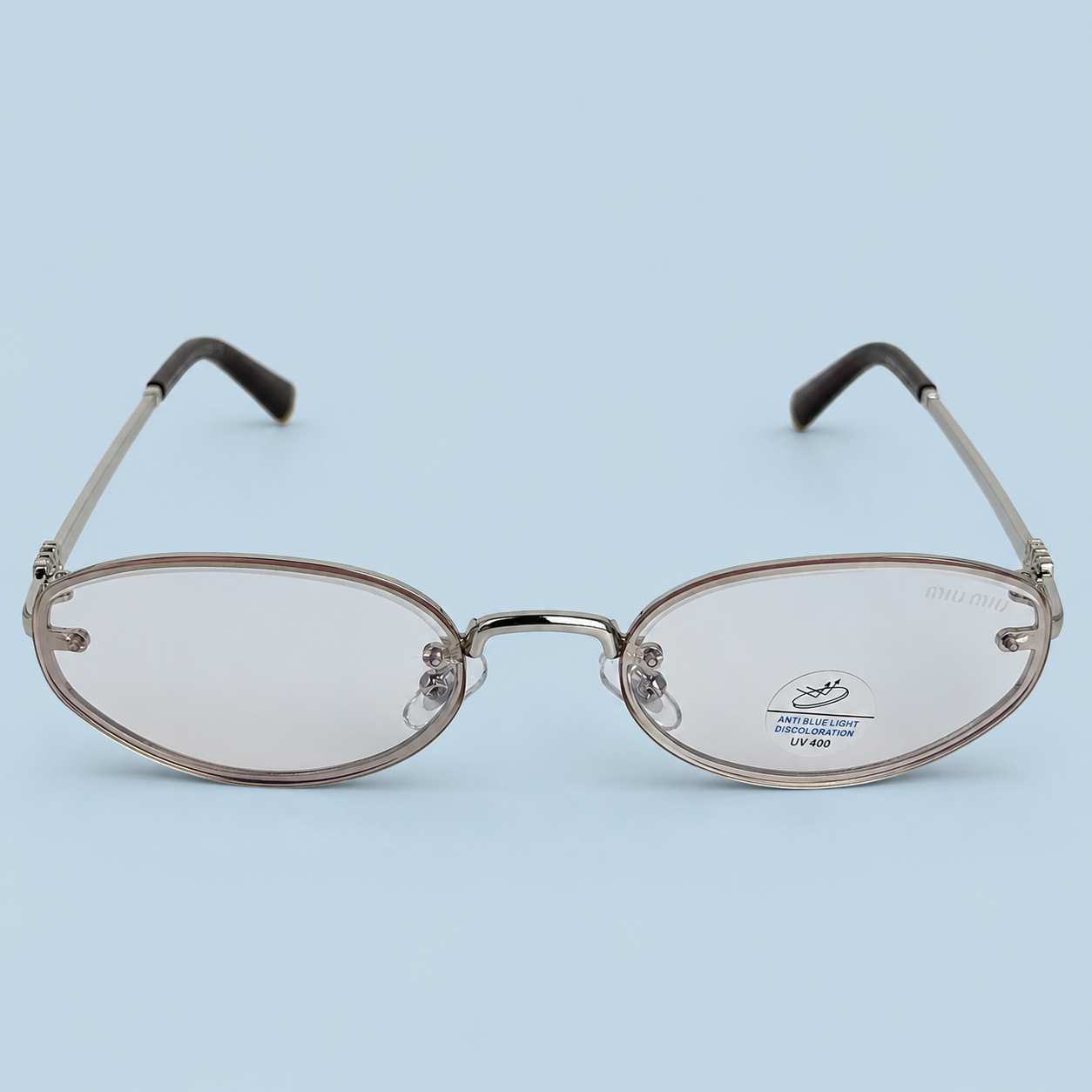MIU MIU — Monture Ovale Sans Cerclage, Métal Argenté, Verres Clairs