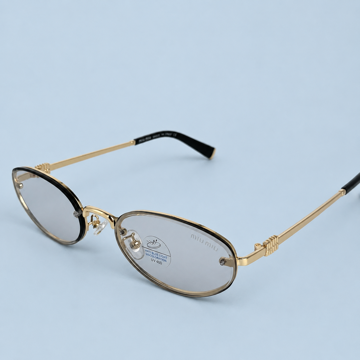 MIU MIU — Monture Ovale Sans Cerclage, Métal Doré, Verres Teintés Gris
