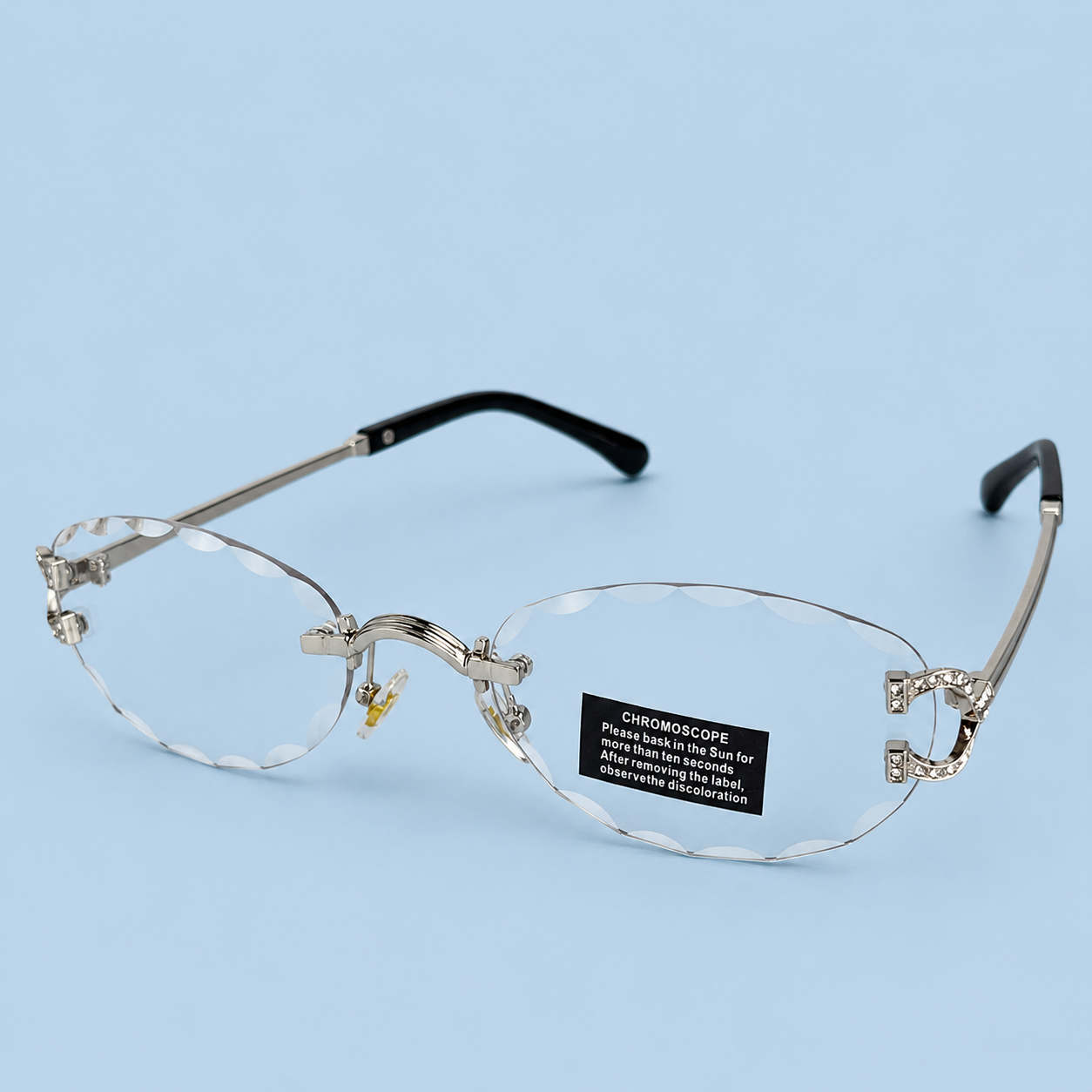 CARTIER — Monture Ovale Rimless Photochromique, Logos Sertis de Strass